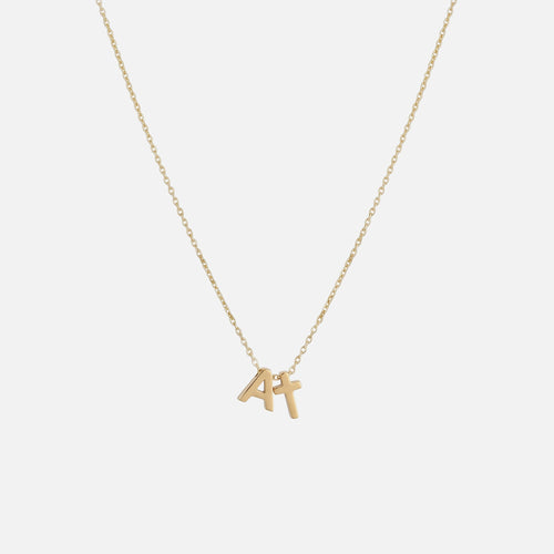 Initial Cross Necklace — studio shot